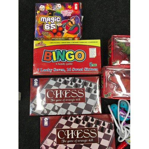 178 - Collection of new and used games and toys to include Chess, dinosaurs, bingo, magic set etc.