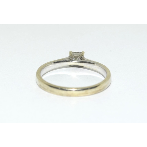 317 - A 9ct Gold and Diamond solitaire ring with diamond shoulders, Size M