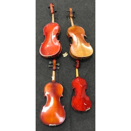 148 - Four cased violins to include vintage examples