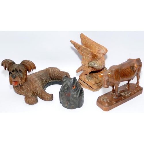 48 - Collection of artisan carved figures in the Black Forest style including a pocket watch stand. Eight... 