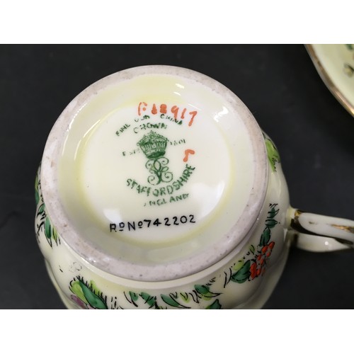 118 - Crown Staffordshire fine bone china tea set for six with extras in a decorative floral pattern. 23 p... 