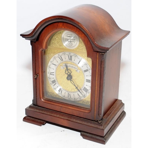 375 - Two mantel clocks, a heavy gilded cast metal quartz example and a wooden mechanical striking clock, ... 