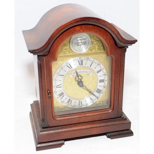 375 - Two mantel clocks, a heavy gilded cast metal quartz example and a wooden mechanical striking clock, ... 