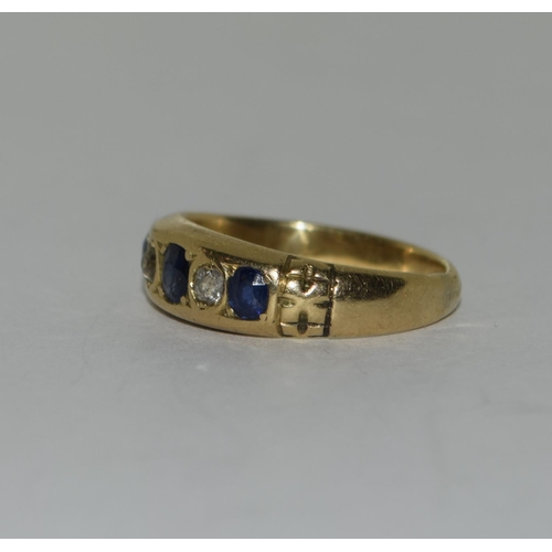 427 - 18ct diamond and sapphire five stone ring. Size M