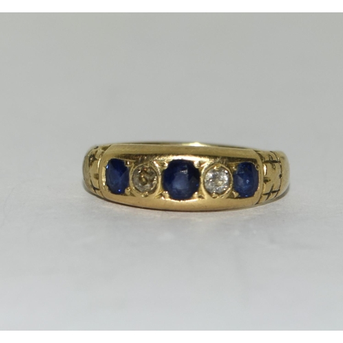 427 - 18ct diamond and sapphire five stone ring. Size M