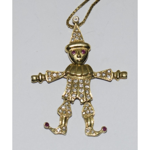 377 - 18ct metamorphic clown on a 9ct chain with a 9ct ring.