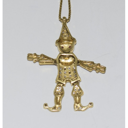 377 - 18ct metamorphic clown on a 9ct chain with a 9ct ring.