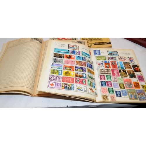 220 - A number of vintage schoolboy stamp albums containing many world stamps. Includes Penny Black, Penny... 