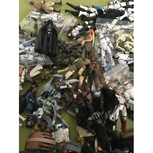 12 - Approx 100 Star Wars modern figures.