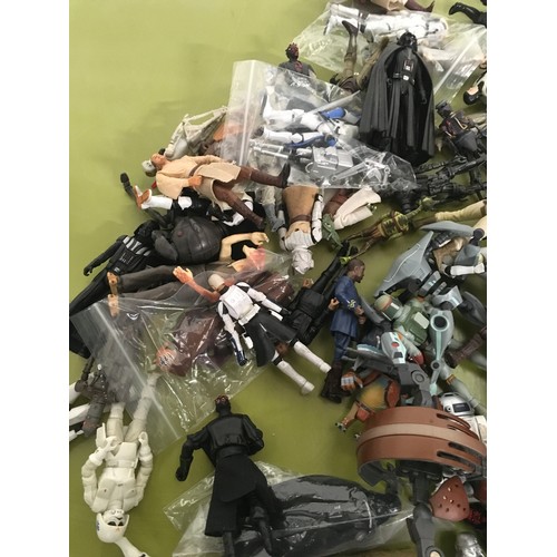 12 - Approx 100 Star Wars modern figures.