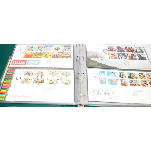 228 - Three albums containing a number of first day covers including coin covers