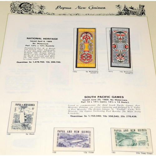 229 - Two stamp albums, one with world first day covers and the other dedicated to stamps of Papua New Gui... 