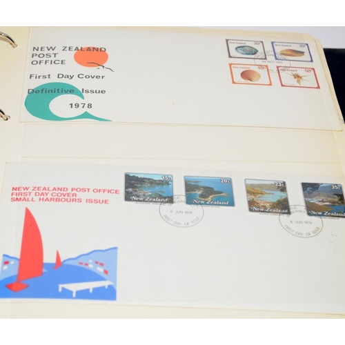 229 - Two stamp albums, one with world first day covers and the other dedicated to stamps of Papua New Gui... 