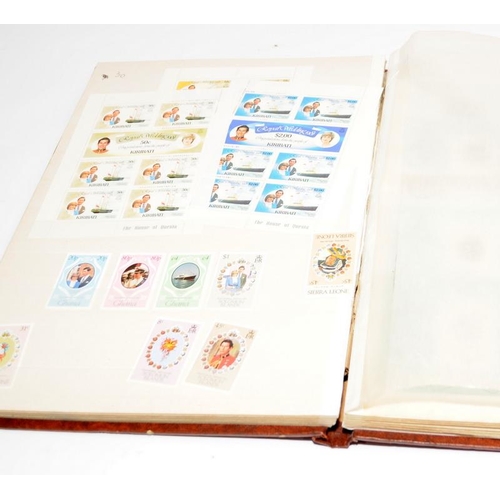 230 - Three stamp albums to include QEII Coronation Omnibus, a stock book of unused world stamps relating ... 