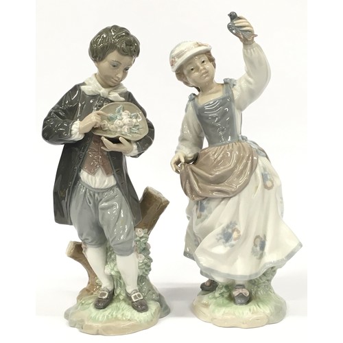 2 - Two Lladro figurines of a boy with flowers and a girl with a bird.