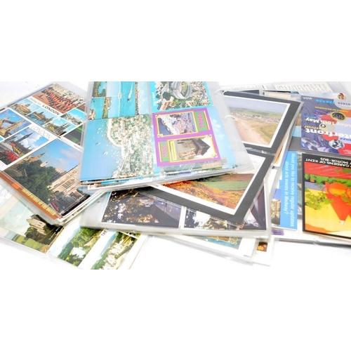 201 - Collection of modern postcards together with a folder of Jersey stamps presentation packs.