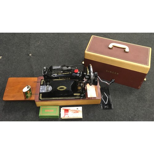 275 - Vintage Singer model 99K electric sewing machine in clean condition with accessories.