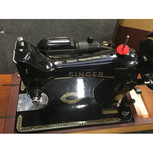 275 - Vintage Singer model 99K electric sewing machine in clean condition with accessories.