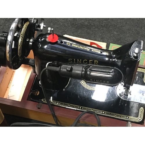 275 - Vintage Singer model 99K electric sewing machine in clean condition with accessories.