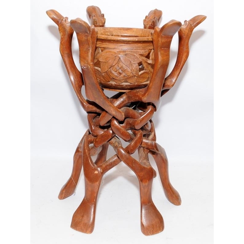 79 - Vintage carved wood camel stand with six interlocking legs carved from a single piece. With centre c... 