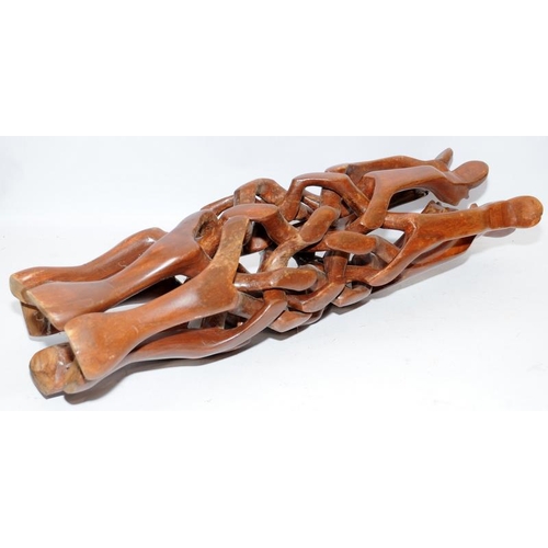 79 - Vintage carved wood camel stand with six interlocking legs carved from a single piece. With centre c... 