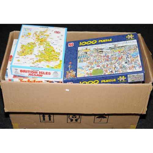 180 - Large box of jigsaw puzzles and games