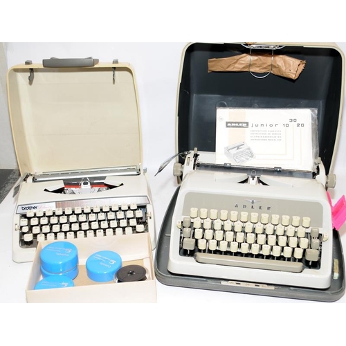 80 - Two vintage typewriters, an Adler Junior 20 c/w user guide and a Brother De Luxe 900 with spare ribb... 