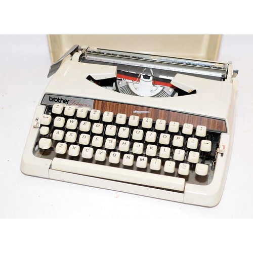 80 - Two vintage typewriters, an Adler Junior 20 c/w user guide and a Brother De Luxe 900 with spare ribb... 