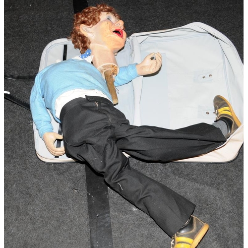 82 - Suitcase containing a vintage ventriloquist's dummy requiring some attention