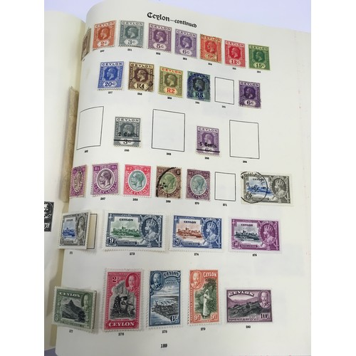 183 - Large red Stanley Gibbons album  containing a large collection of quality world stamps (world 1st co... 