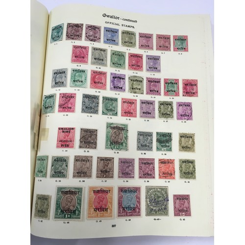 183 - Large red Stanley Gibbons album  containing a large collection of quality world stamps (world 1st co... 