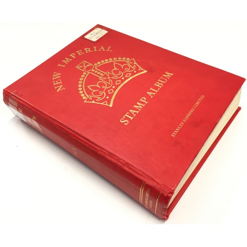 183 - Large red Stanley Gibbons album  containing a large collection of quality world stamps (world 1st co... 