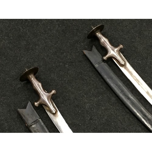 116 - Pair of antique swords with leather sheaths.