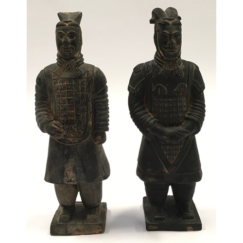 52 - Pair of miniature terracotta warrior figures the tallest measuring 23cm in height.