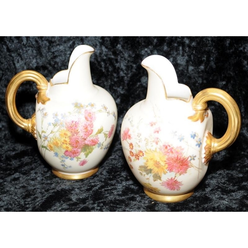 36 - Pair of antique Royal Worcester blush ivory gilded flat back jugs with hand painted floral decoratio... 