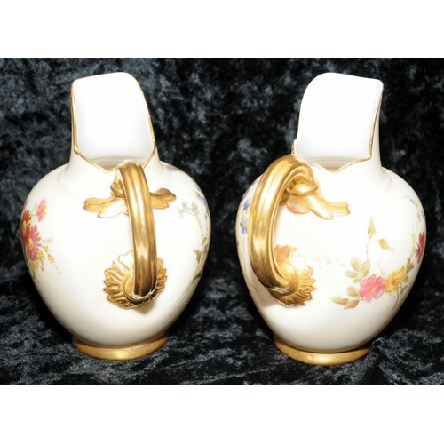 36 - Pair of antique Royal Worcester blush ivory gilded flat back jugs with hand painted floral decoratio... 