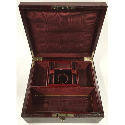 137 - Leather travelling jewellery box with hidden compartment with a Bramah lock & key. Watered silk inte... 