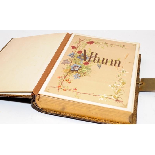 214 - Victorian musical photograph album with gilded tooled leather boards. Good cosmetic condition. no ke... 