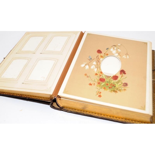 214 - Victorian musical photograph album with gilded tooled leather boards. Good cosmetic condition. no ke... 