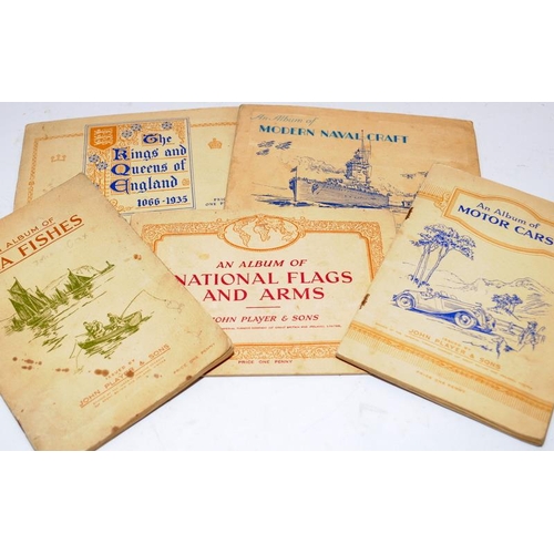 206 - Interesting collection of stamps, cigarette cards and early matchbox covers contained within a numbe... 