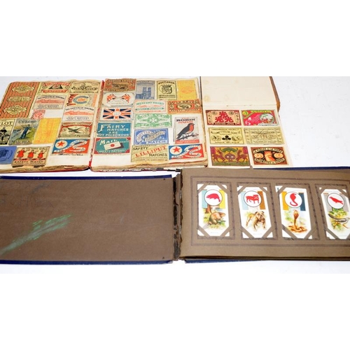 206 - Interesting collection of stamps, cigarette cards and early matchbox covers contained within a numbe... 