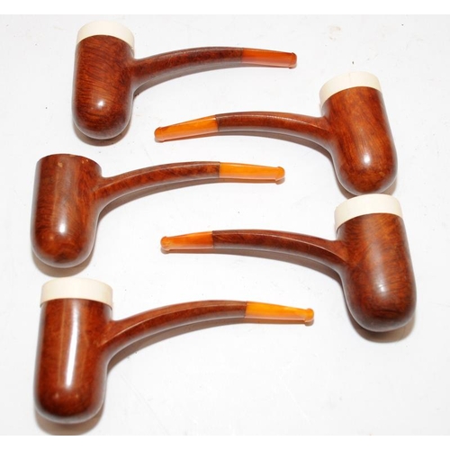 251 - Collection of vintage briar pipes with amber mouthpieces, includes a silver collar example and a num... 