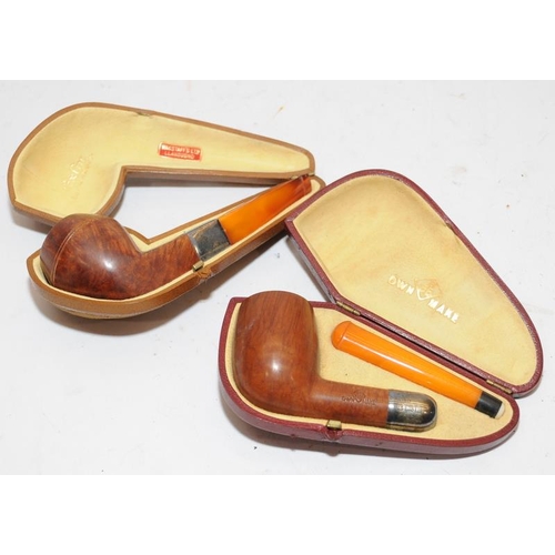 260 - Two quality antique pipes with hallmarked silver collar and butterscotch amber stem. Presented in un... 