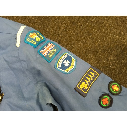 138 - Girl Guides interest: items of uniform with a good collection of badges together with a vintage hand... 