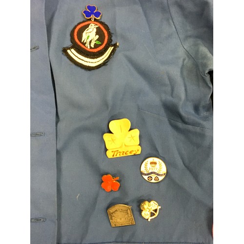 138 - Girl Guides interest: items of uniform with a good collection of badges together with a vintage hand... 