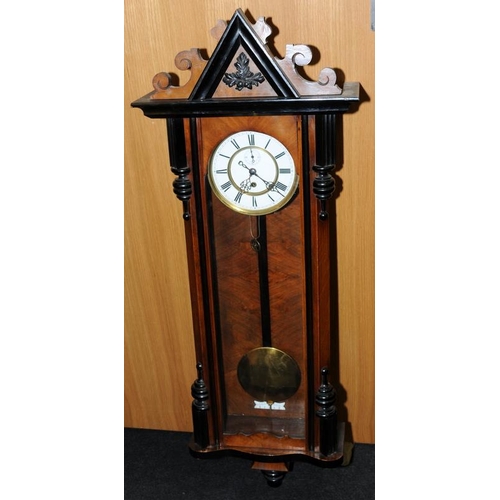 335 - Walnut single weight Ebonized enamel dial Vienna wall clock with brass pendulum by 