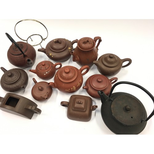 67 - Collection of oriental terracotta teapots (12).