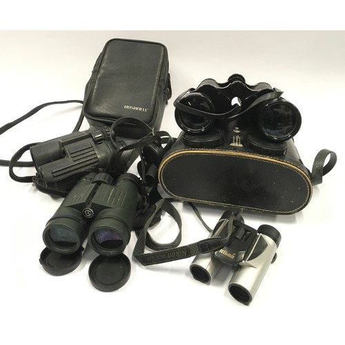 134 - Collection of binoculars. Some are cased.