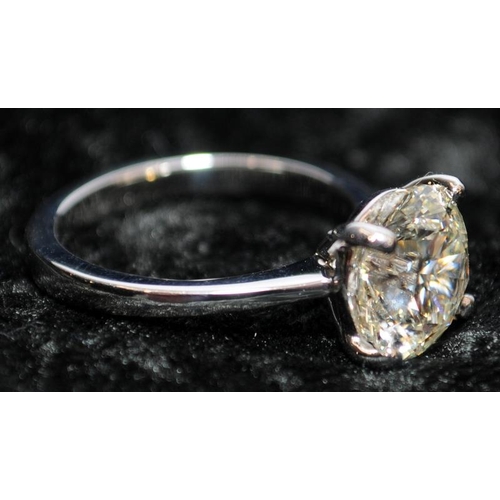 28 - A Platinum diamond solitaire ring, size K, approx. just over 3ct, colour M Clarity VVS2. Buyers comm... 