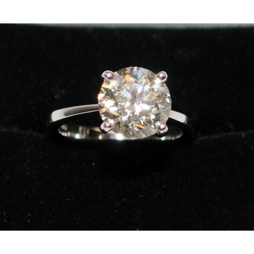 28 - A Platinum diamond solitaire ring, size K, approx. just over 3ct, colour M Clarity VVS2. Buyers comm... 